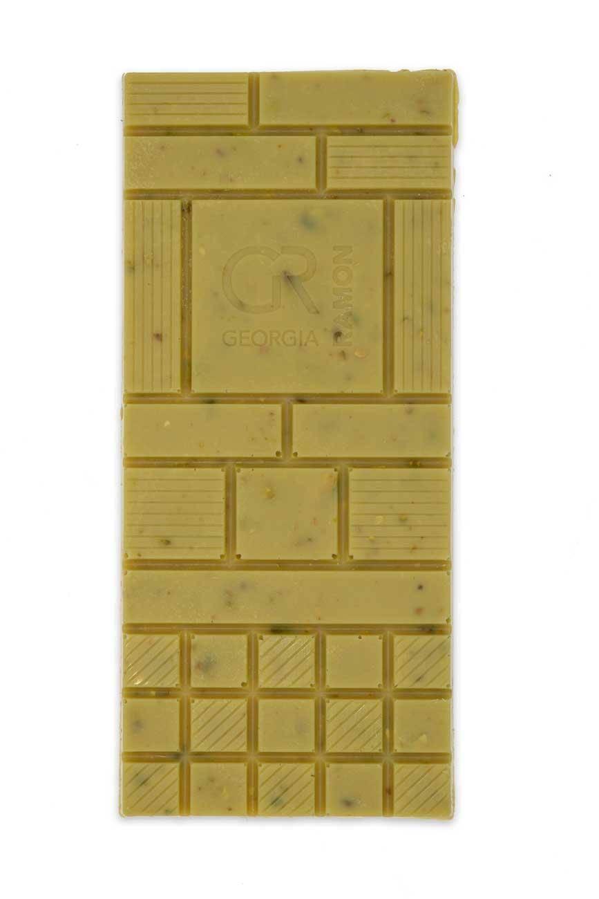 Unverpackte weiße Schokolade von Georgia Ramon mit grünen Pistazien-Kernen in der Schokolade